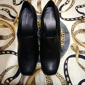 Women's black pumps by Covington